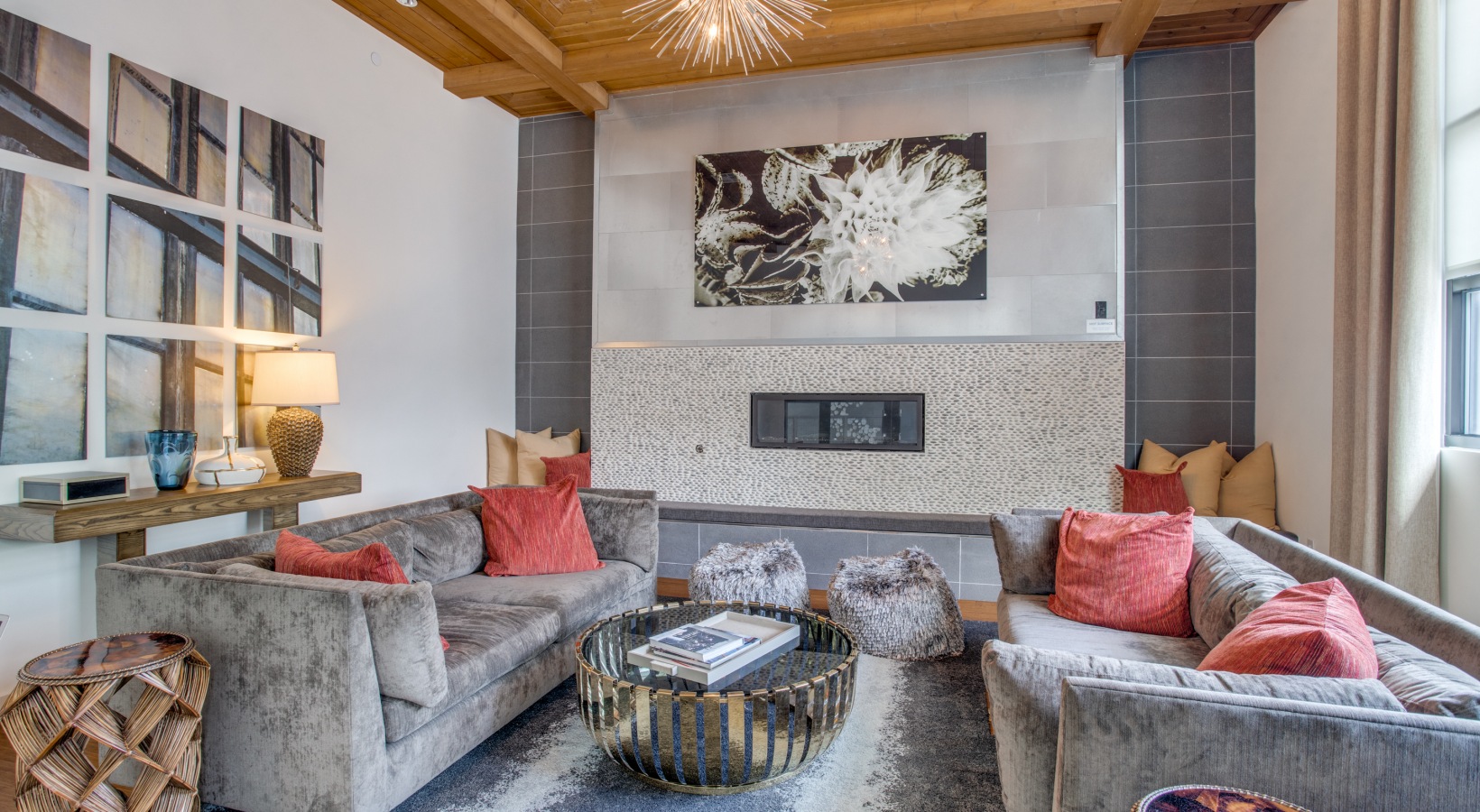 a living room with a fireplace and couches at The Twin Creeks Crossing
